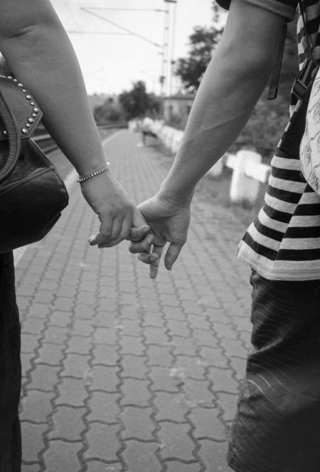 Black-and-white Photo of Hand Holding Snow