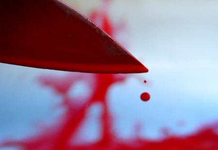 Bloody knife with blood drops