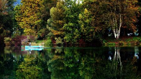 Blue Boat on Sail on Calm Body of Water during Daytime