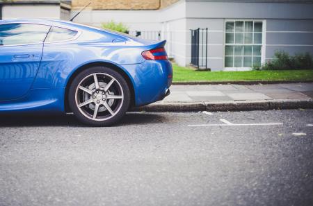 Blue Car Parked Near Grey and White Painted House