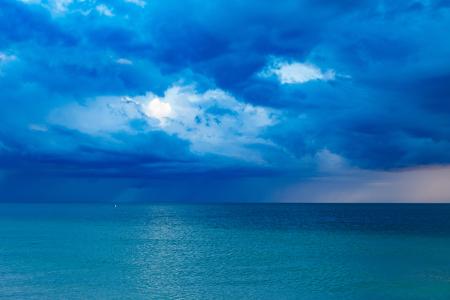 Blue Ocean With Cloudy Sky