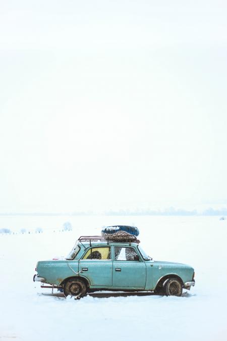 Blue Sedan on Snow