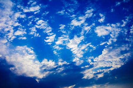 Blue sky with clouds and sun