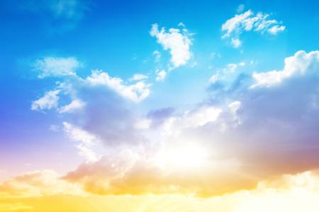 Blue sky with clouds and sun