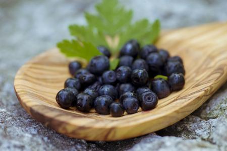 Blueberries in wooden spoon