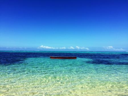 Boat in the Middle of Atoll Photo