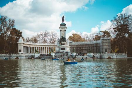 Boat in Water and Building With Statue