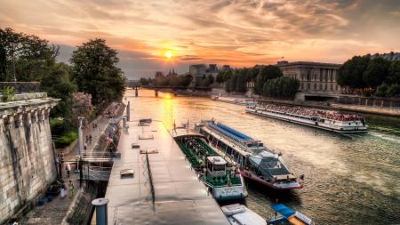 Boats on a River Next to Buildings