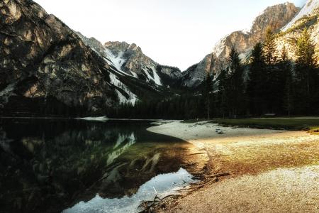 Body of Water Near Trees during Sunset