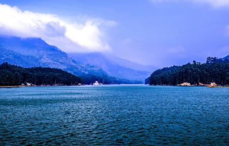 Body of Water Under Blue and White Sky