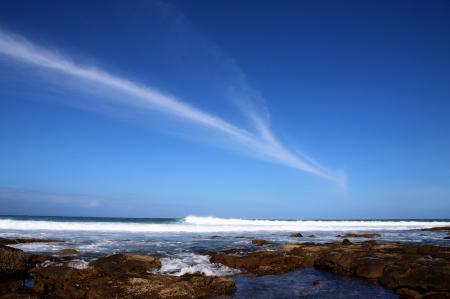 Body of Water Under Blue Sky at Daytime