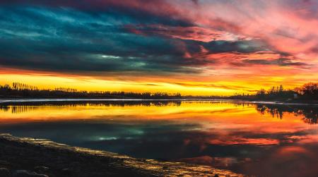 Body of Water Under by Cirrus Clouds during Golden Hour