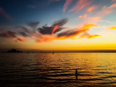 Body of Water Under Calm Sky during Golden Hour