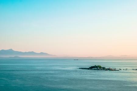 Body of Water Under Clear Blue Sky during Daytime