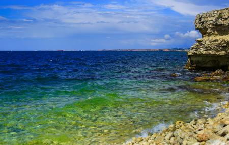 Body of Water Under Cloudy Sky during Daytime