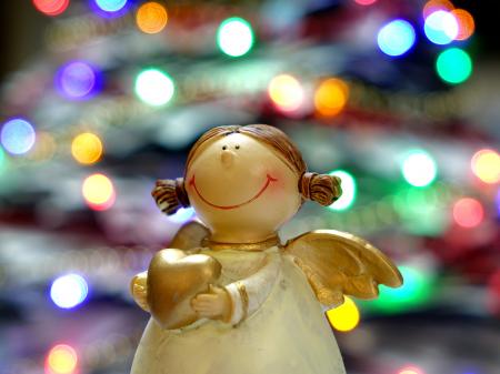 Bokeh Shot of White and Gold Ceramic Angel