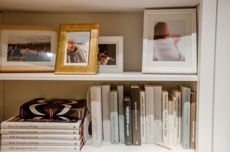 Bookshelves with books and photo frames