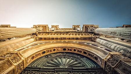 Bottom View of Vintage Arch during Daytime