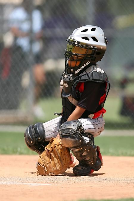 Boy in Black Power Balt Baseball Helmet