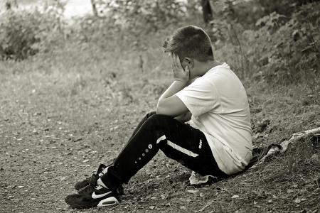 Boy in White Shirt and Black Track Pants