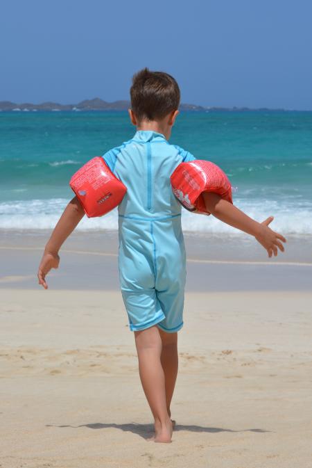 Boy on Blue Onesie on Beach during Day