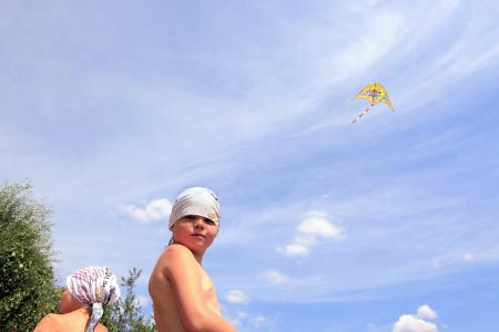 boy plays kite