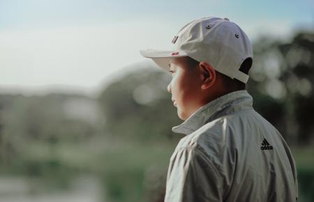 Boy Wearing Adidas Jacket and Gray Fitted Cap
