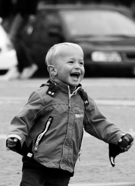 Boy Wearing Jacket on Street in Grayscale Photography