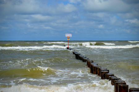 Breakwaters with a wooden deck in a stormy sea