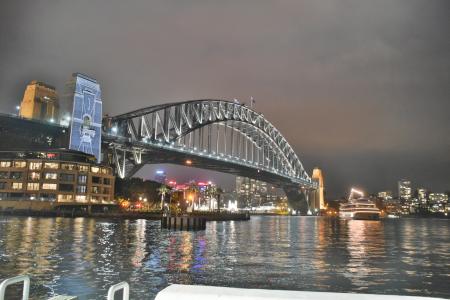 Bridge Under Grey Cloudy Sky During Nighttime