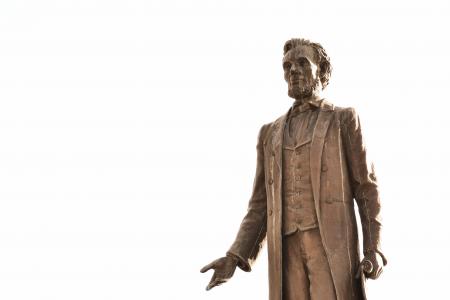 Bronze statue of a man in a retro suit