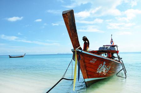 Brown Boat Docked at the Seaside Under the Clear Blue Skies