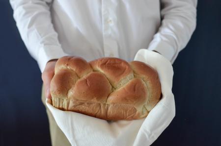 Brown Bread Held by a Person