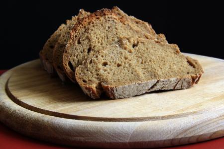 Brown Bread on Round Wooden Tray