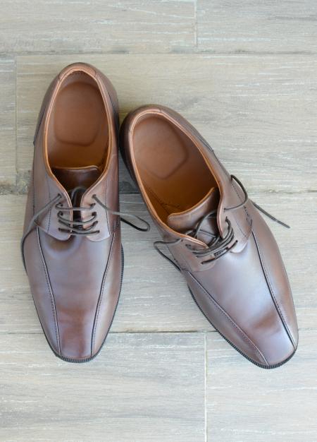 Brown Business Shoes on Wood Floor