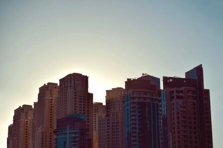 Brown City Skyline Under White and Gray Clear Sky during Daytime