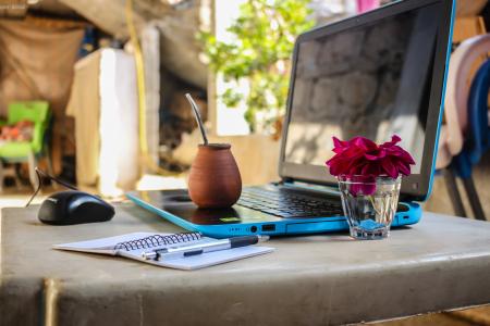 Brown Clay Pot On Black And Blue Laptop