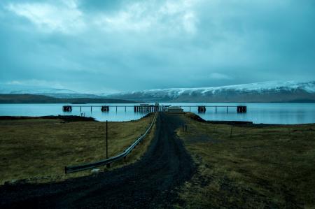 Brown Dock Near Snow Mountain at Daytime