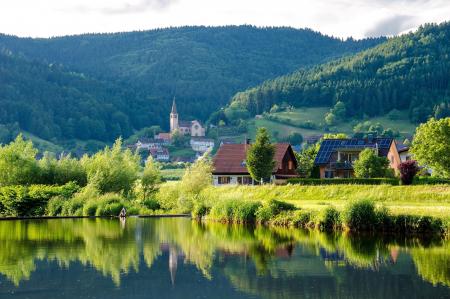 Brown Grey Wooden House Near Lake at Daytime