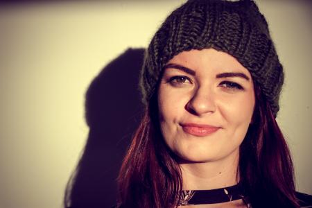 Brown Haired Woman Wearing Black Knitted Hat