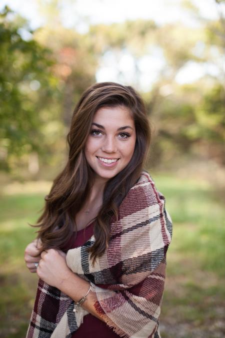 Brown Haired Woman Wearing Burberry Scarf