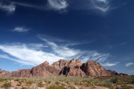 Brown Mountain Under Blue and White Sky during Daytime