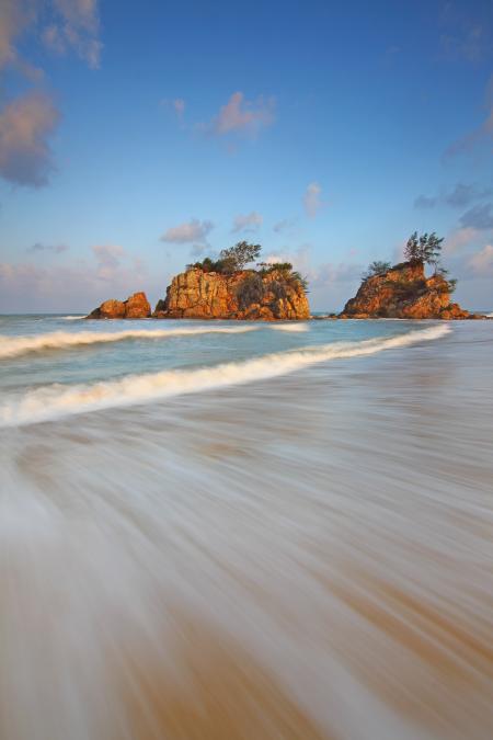 Brown Rock Formation Along the Sea during Daytime