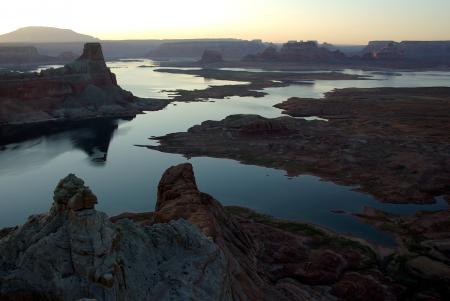 Brown Rock Formation in Between Body of Water during Golden Hour