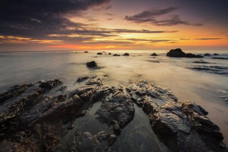 Brown Rock Formation Under Sunset