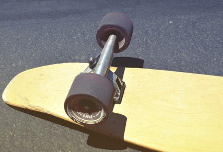 Brown Skateboard on Concrete Road