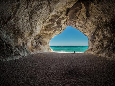 Brown Tunnel Near Body of Water