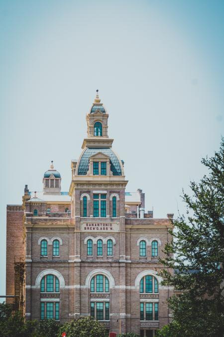 Brown, White and Blue Concrete Building Under White and Blue Sky