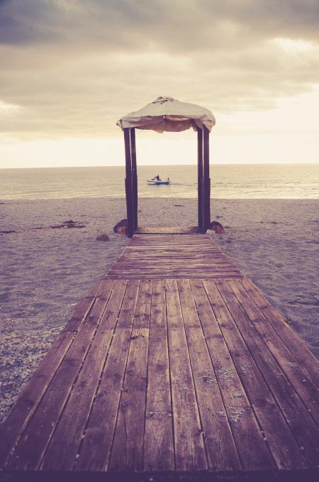 Brown Wooden Dock and White Canopy Tent Near Body of Water