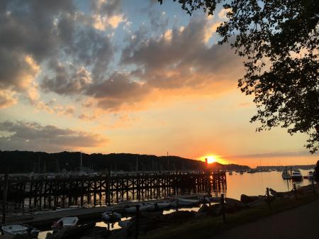 Brown Wooden Dock on Body of Water during Sunset